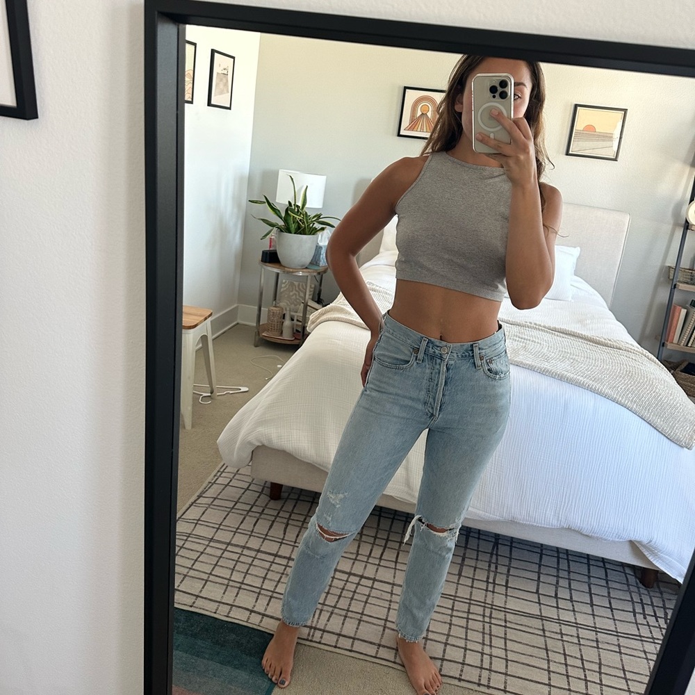 AGOLDE size 25 slim leg, white wash jean with minor rip!
